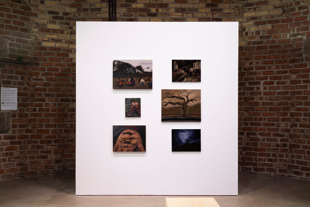 Installation view of the six paintings in the brick interior of Collective's dome gallery.