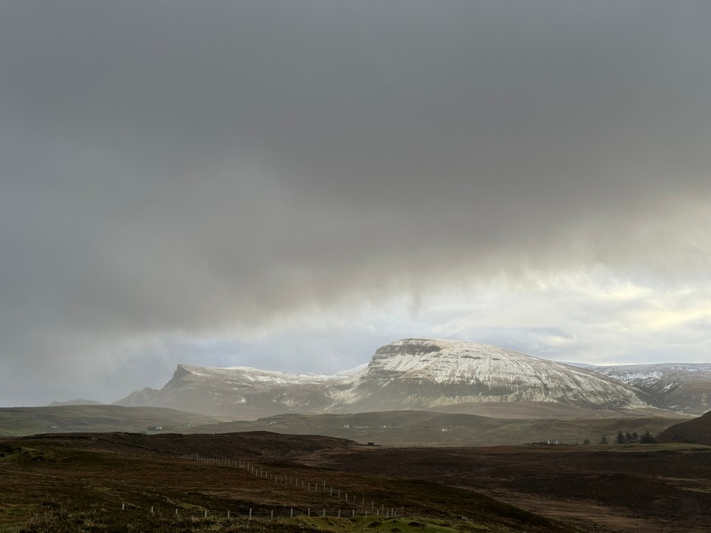dark clouds coming in, overshadowing the snowy quirang
